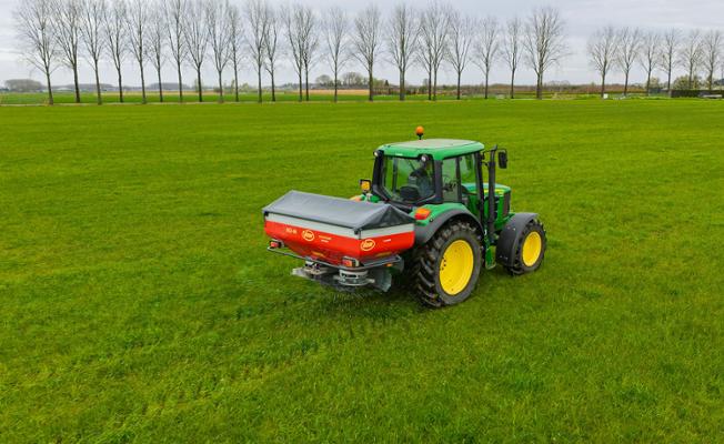 Spreader on a field