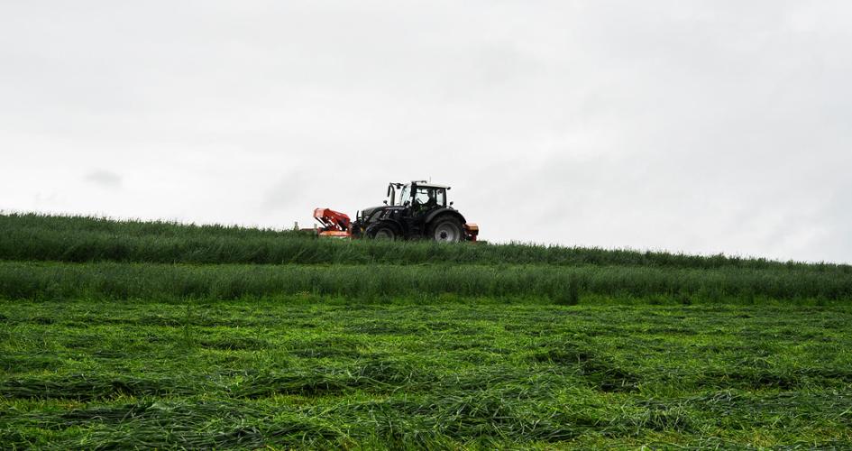 Spreader on a grassland field 