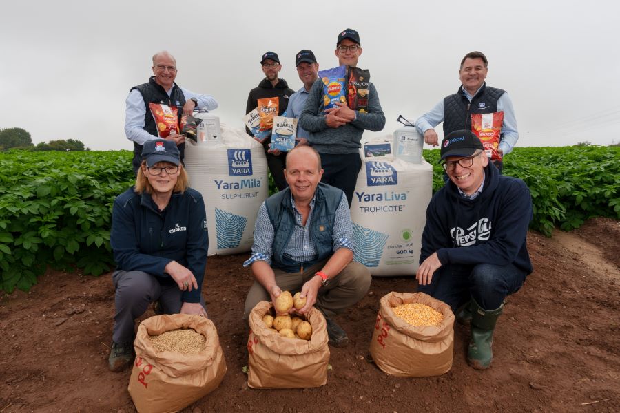 Yara and Pepsi co staff in a potato field with Yaramila and yaraliva fertiliser products 