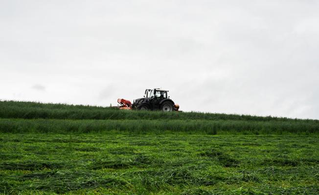 Spreader on a grassland field 
